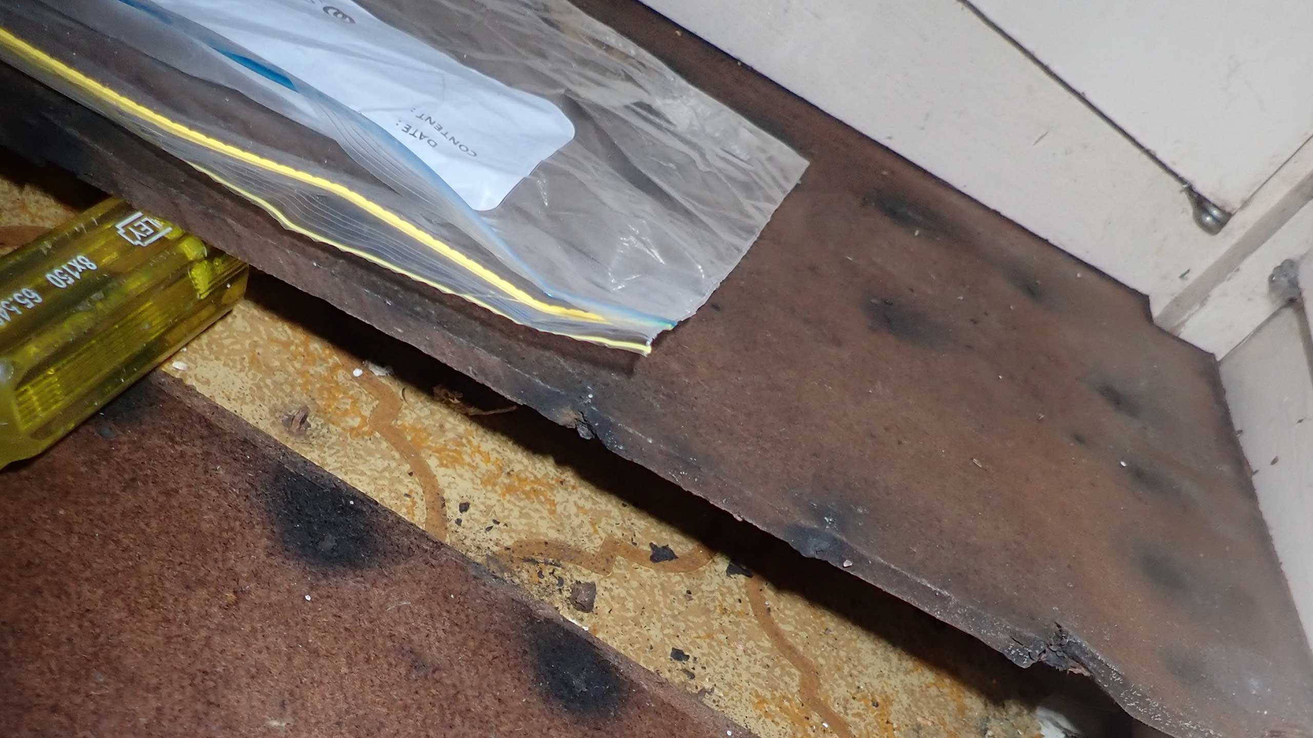 Asbestos-backed floor vinyl found during intrusive inspection