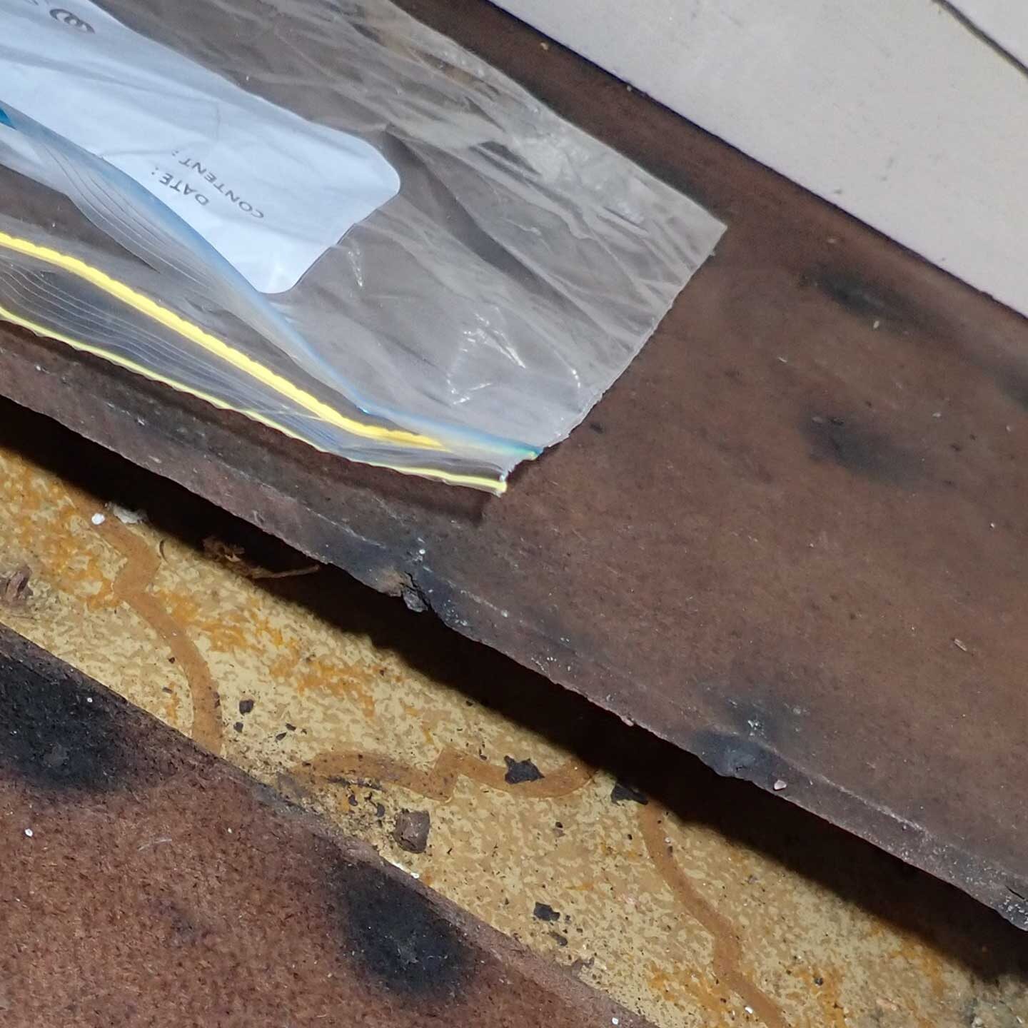 Asbestos-backed floor vinyl found during intrusive inspection