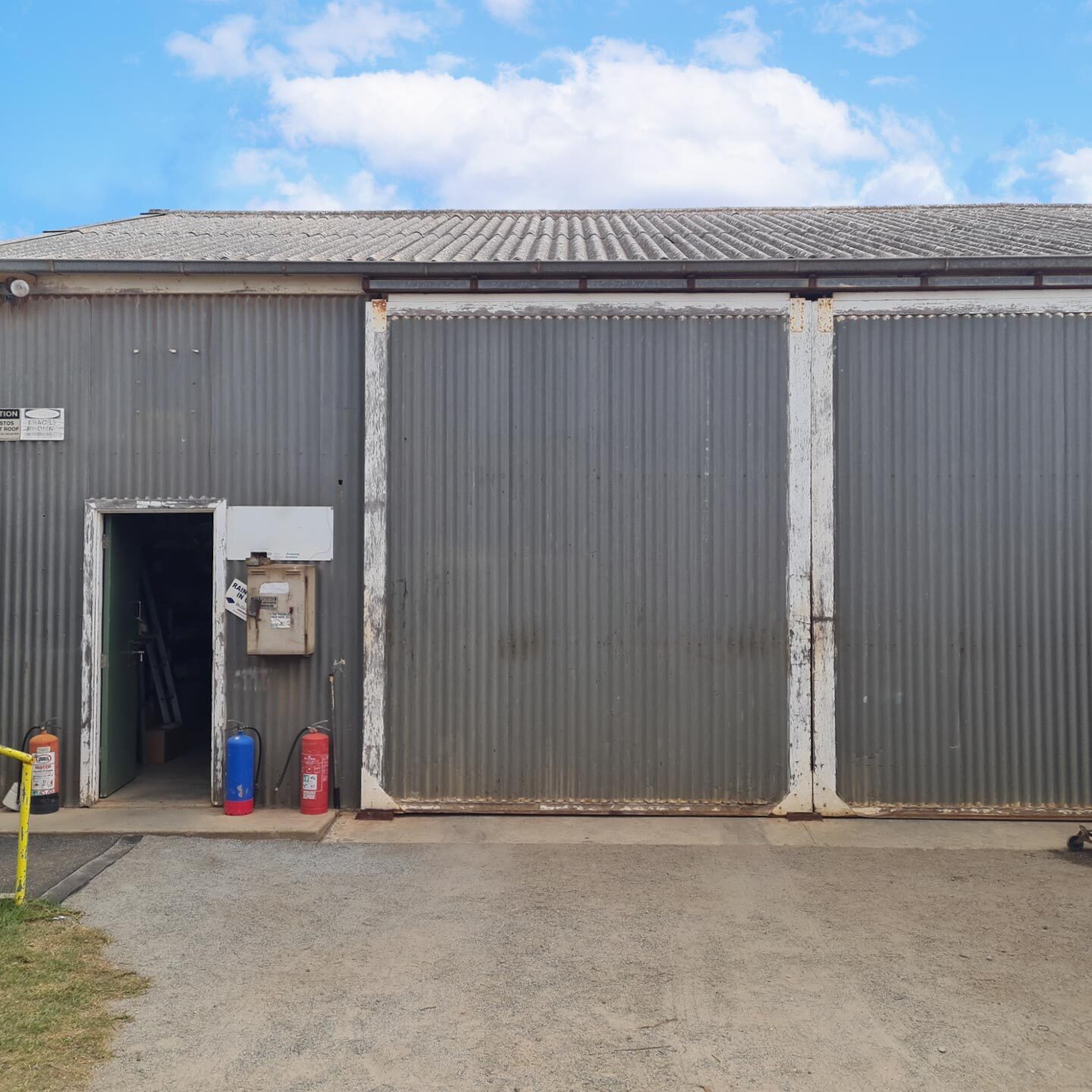 "Deep 6" corrugated asbestos cement roof cladding on old workshop