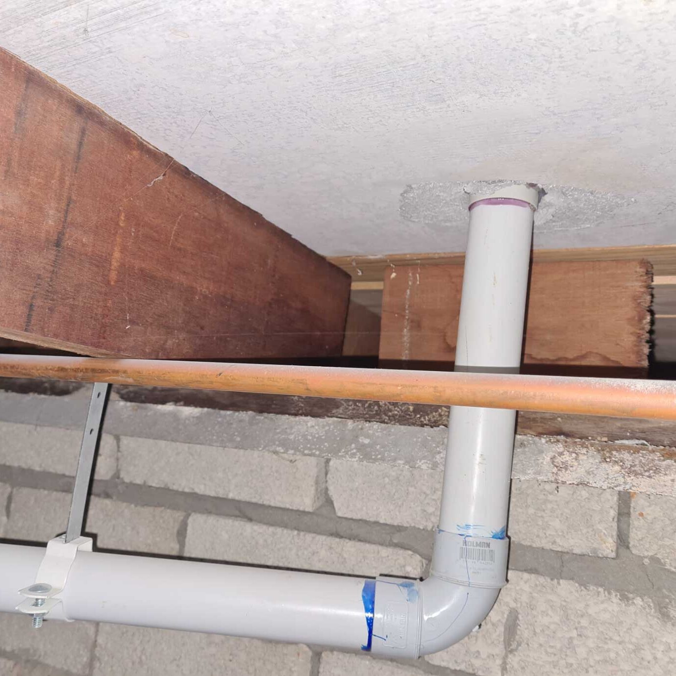 Intrusive inspection below floor revealed hidden asbestos cement substrate floor under ceramic tiles in bathroom